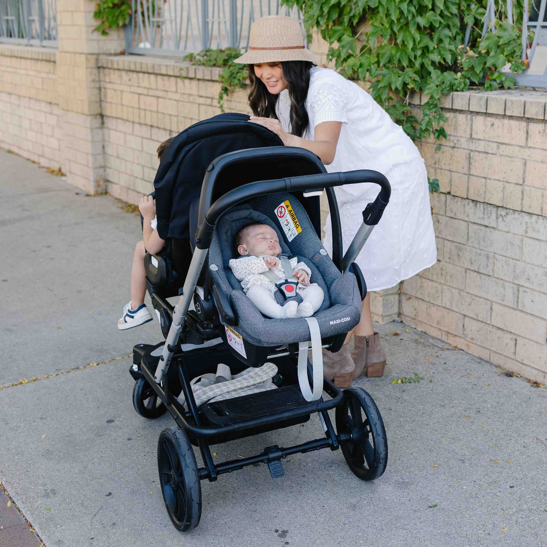 big wheels on the twin stroller with one child and one infant